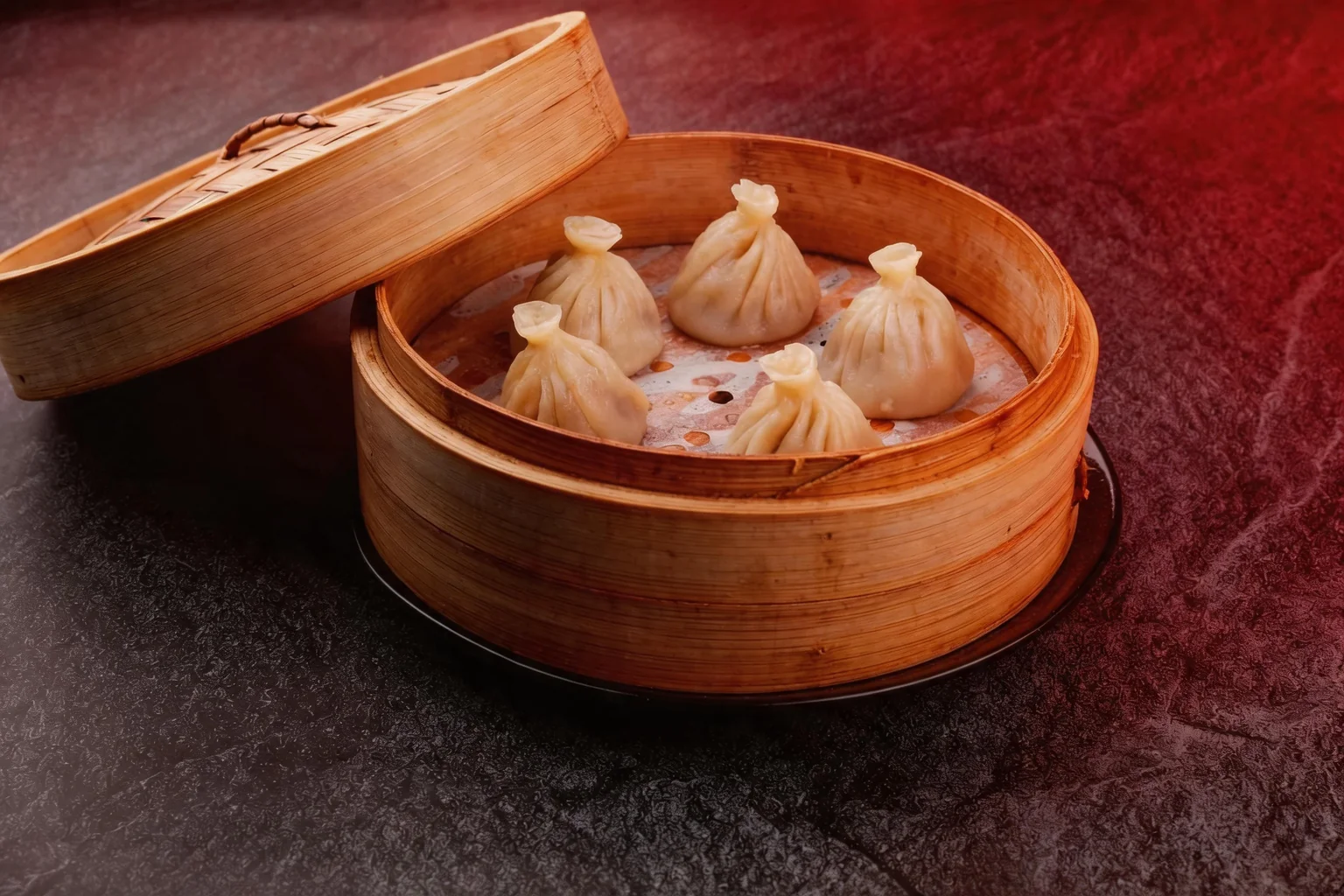 Steamed momos in their bamboo basket